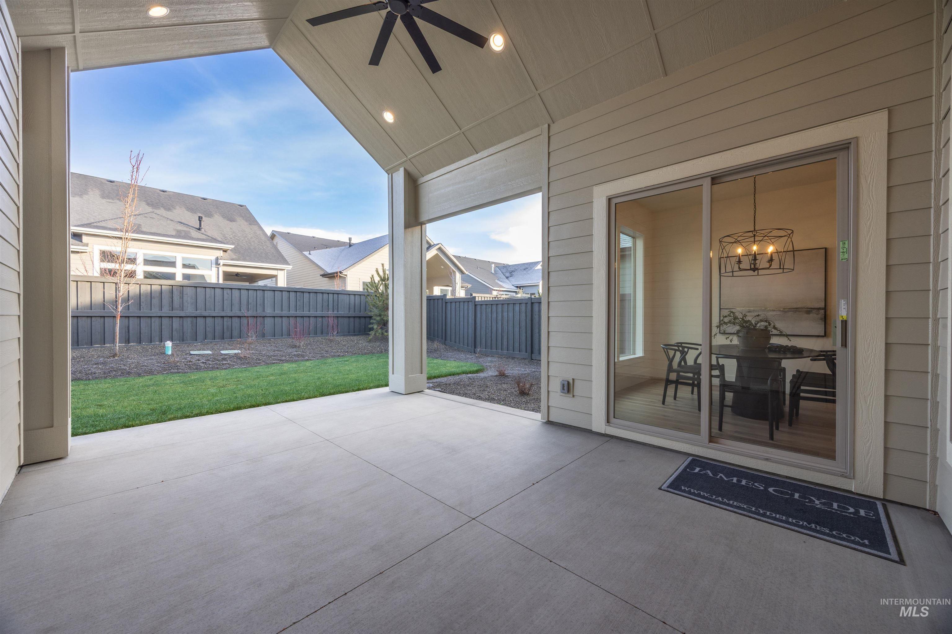 1034 East Escalation Street Meridian, ID 83642 - Photo 38 of 40 Sunroom featuring a patio, a chandelier, a ceiling fan, and lofted ceiling