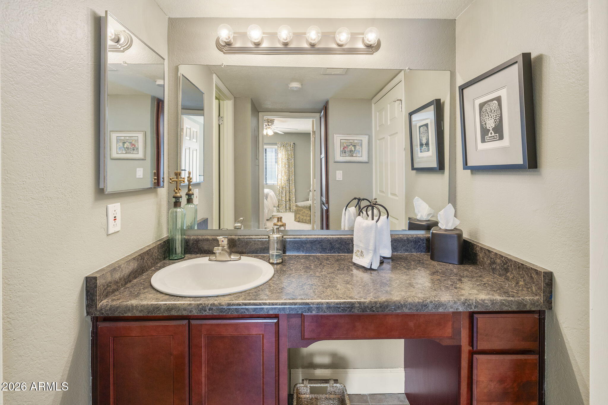 3825 East Camelback Road, Unit 126 Phoenix, AZ 85018 - Photo 16 of 28 a bathroom with sinks granite countertop a sink and a mirror