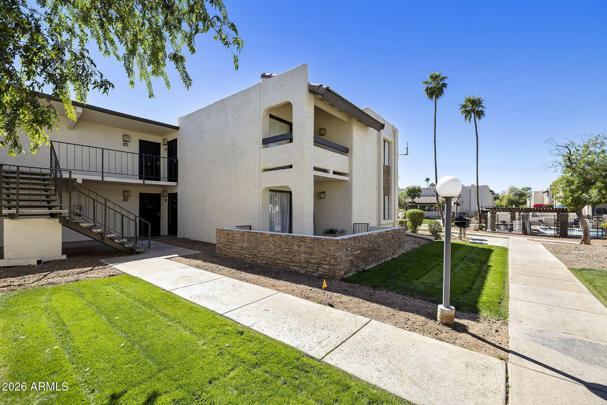 3825 East Camelback Road, Unit 126 Phoenix, AZ 85018 - Photo 20 of 28 a front view of a house with entertaining space