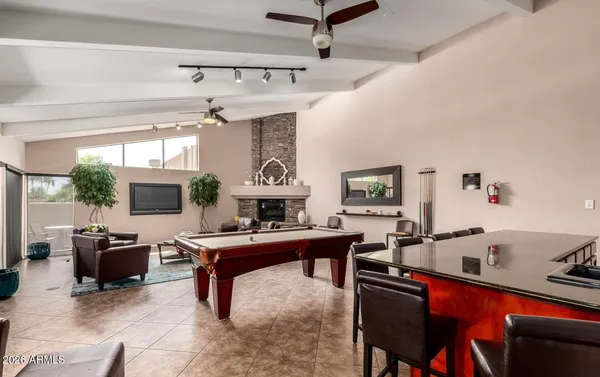 a view of a room with gym equipment and floor to ceiling window