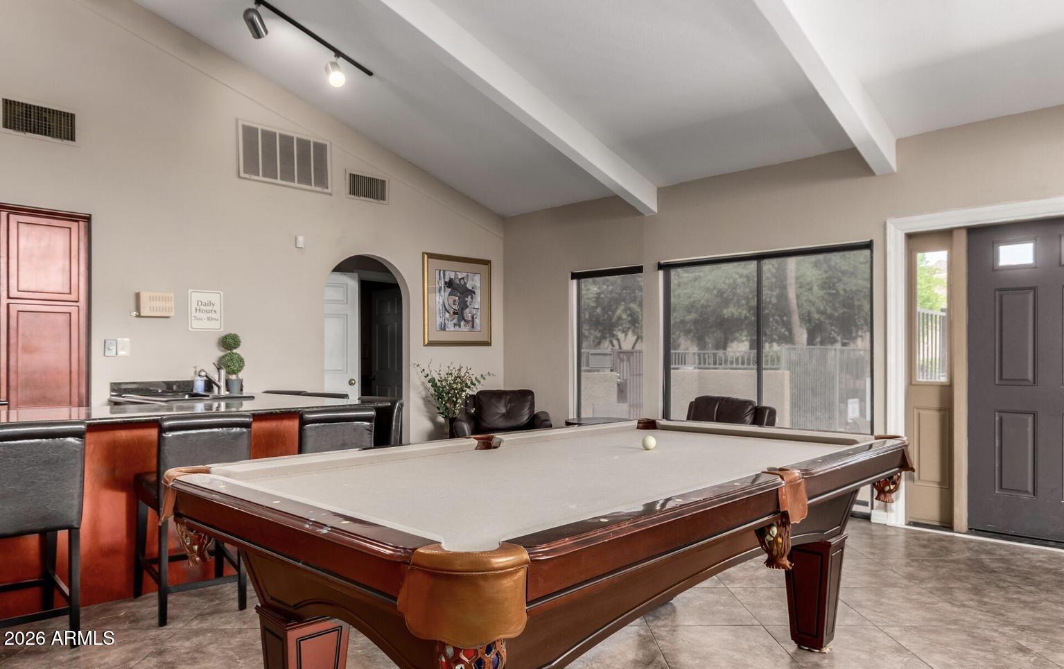 3825 East Camelback Road, Unit 126 Phoenix, AZ 85018 - Photo 26 of 28 a room with pool table and windows