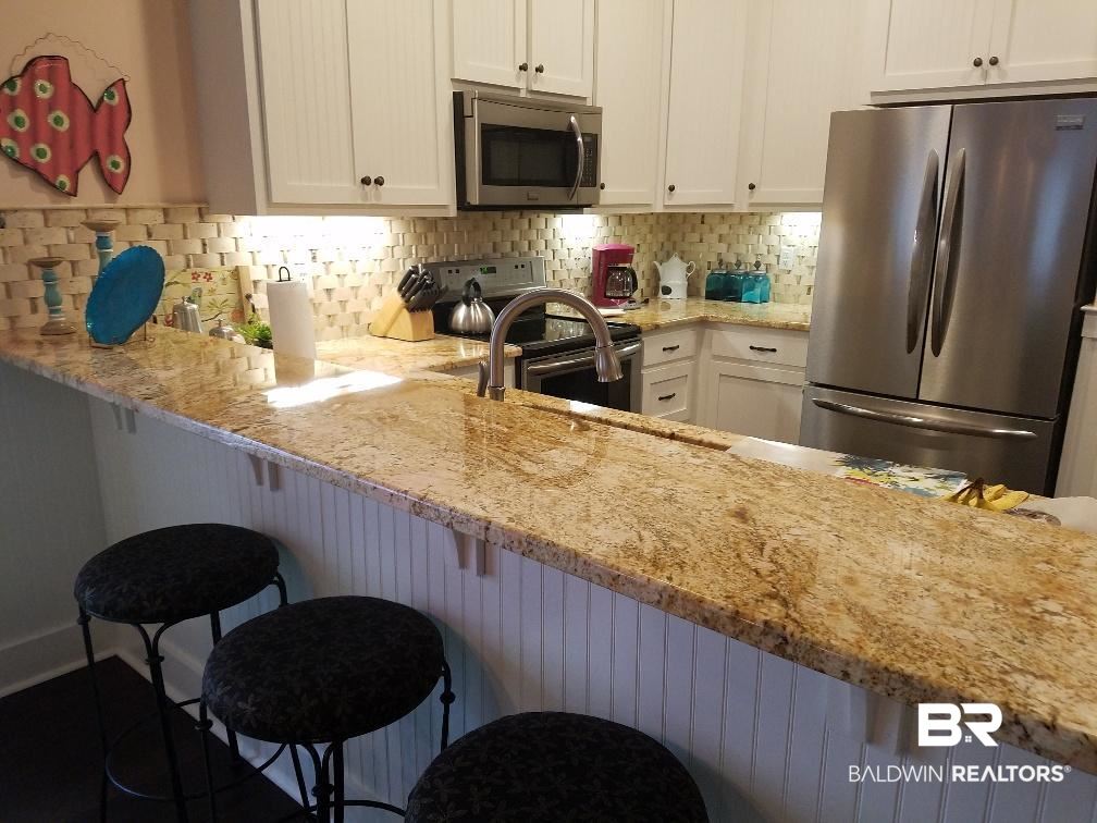 25773 Canal Road, Unit 41 Orange Beach, AL 36561 - Photo 7 of 34 Granite countertops/tile backsplash-gorgeous!
