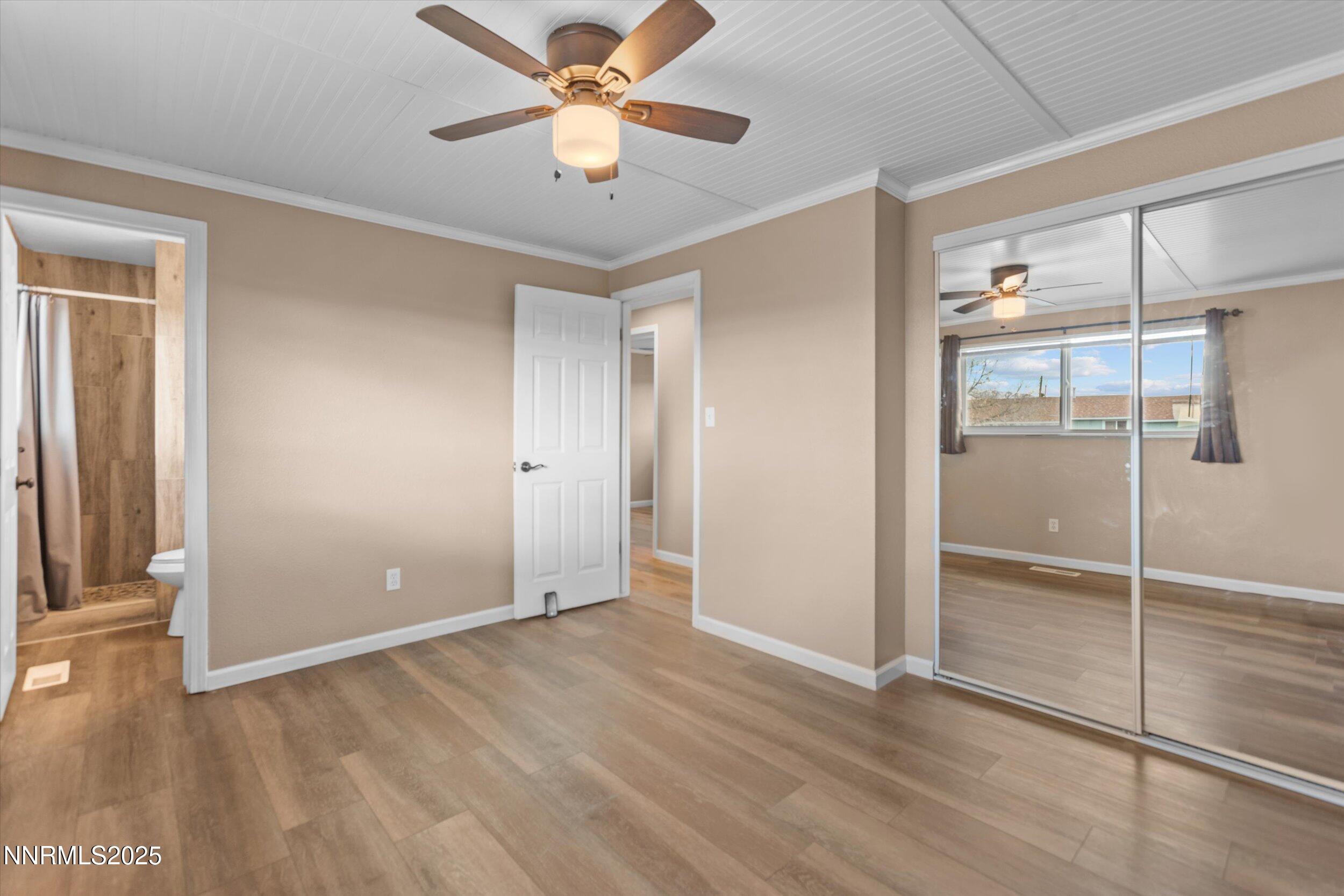 11567 Tupelo Street Reno, NV 89506 - Photo 12 of 32 wooden floor in an empty room with a window