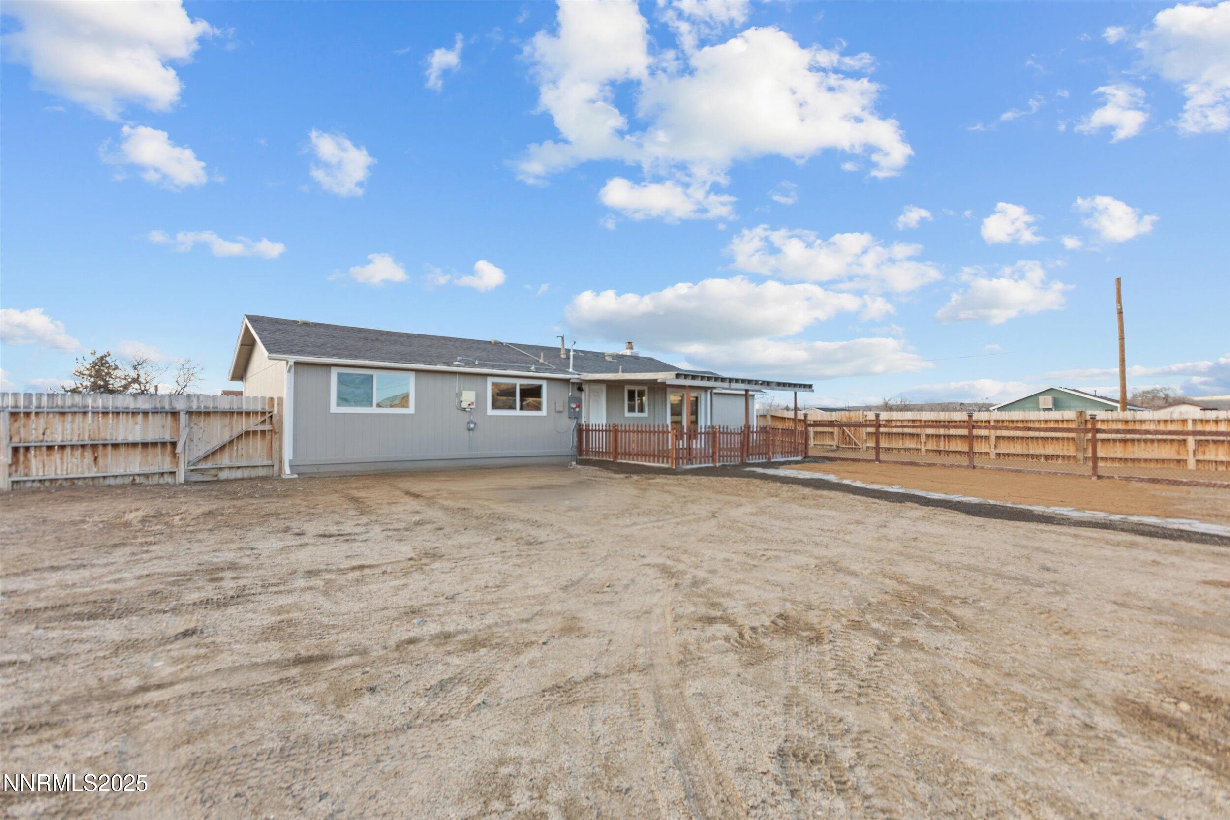 11567 Tupelo Street Reno, NV 89506 - Photo 22 of 32 a view of a house with a yard