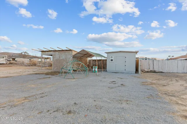 a view of a house with a dry space and street view
