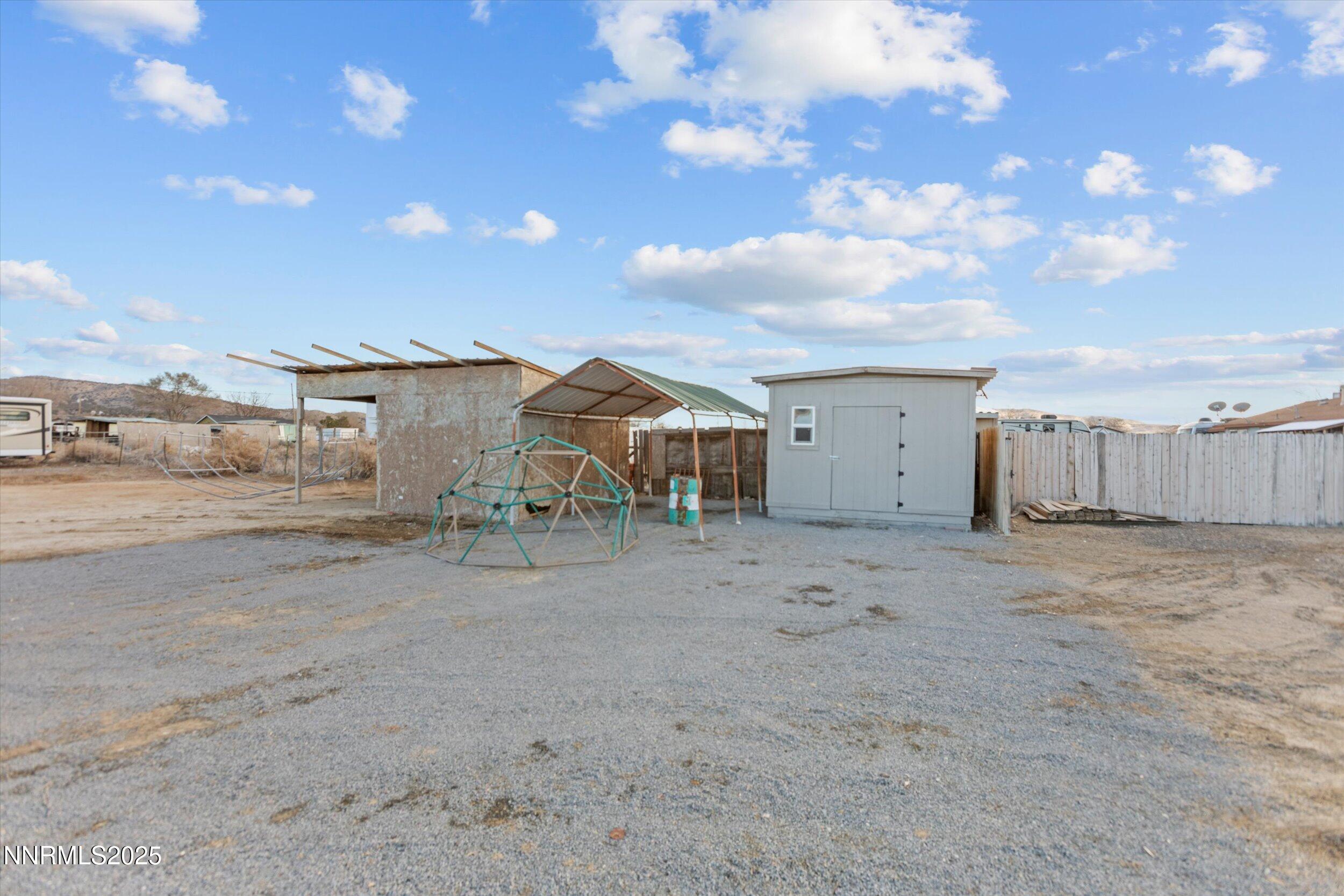 11567 Tupelo Street Reno, NV 89506 - Photo 23 of 32 a view of a house with a dry space and street view