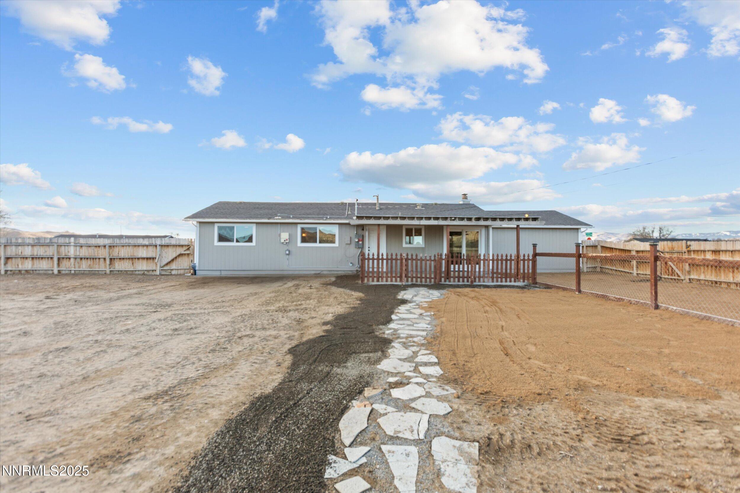 11567 Tupelo Street Reno, NV 89506 - Photo 24 of 32 a view of a house with a yard