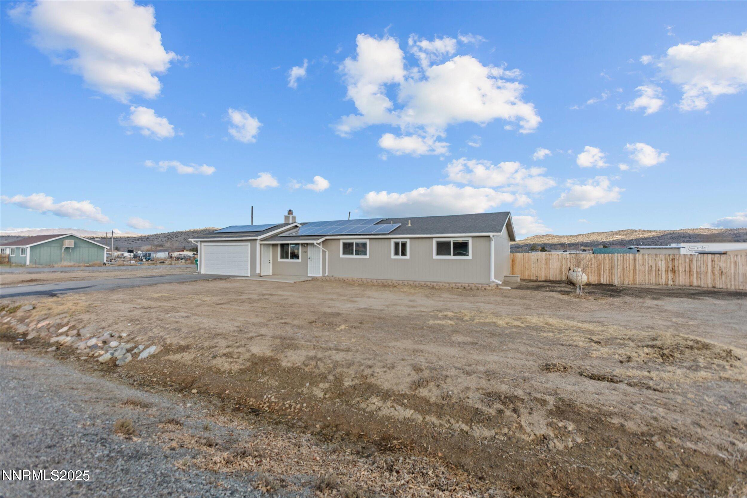 11567 Tupelo Street Reno, NV 89506 - Photo 26 of 32 a view of a house with a yard