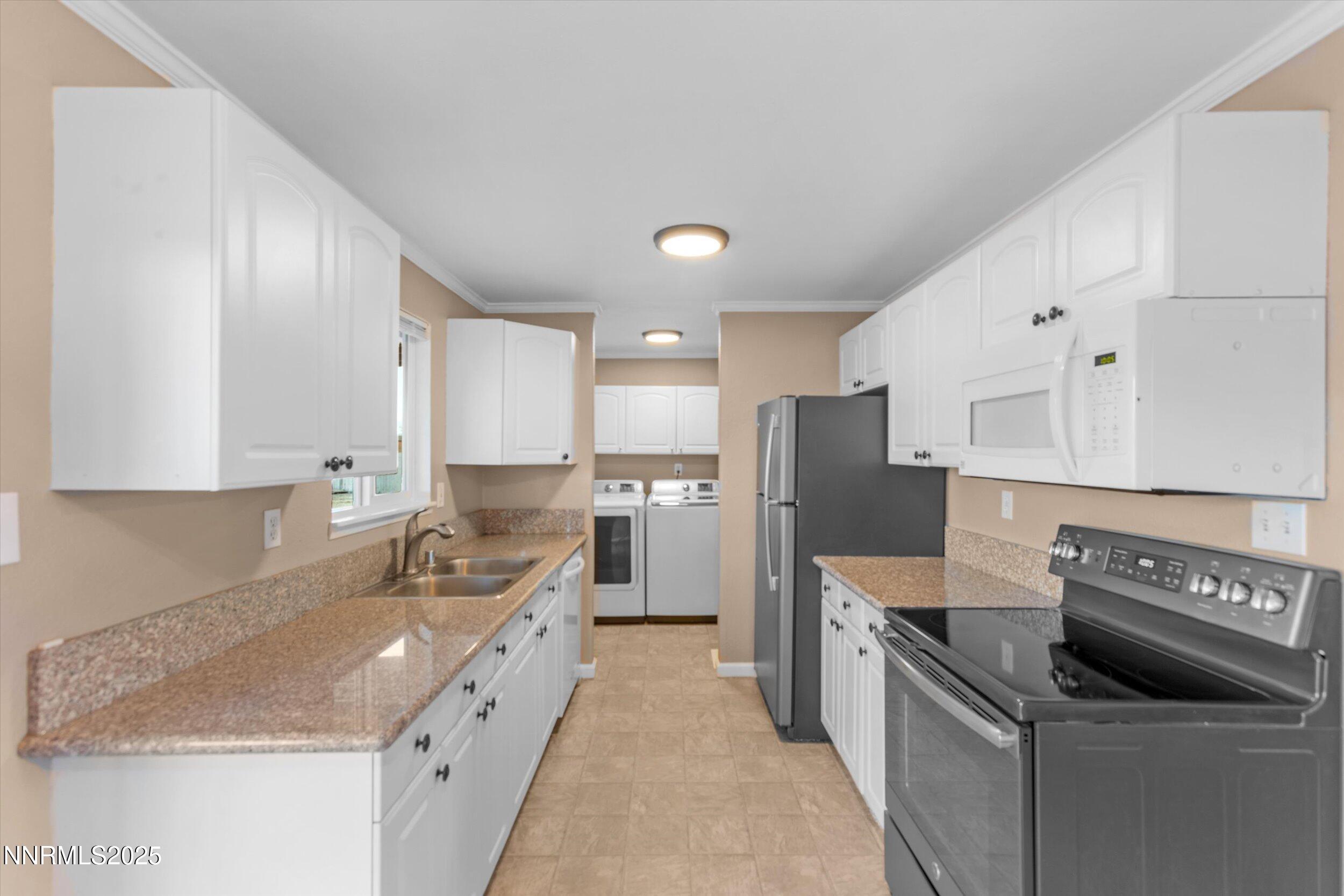 11567 Tupelo Street Reno, NV 89506 - Photo 7 of 32 a kitchen with granite countertop a sink stove and refrigerator
