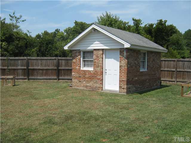 103 Poppy Street Dunn, NC 28334 - Photo 3 of 8 a front view of a house with a yard