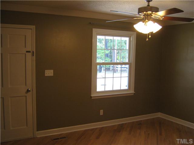 103 Poppy Street Dunn, NC 28334 - Photo 4 of 8 en empty room with a window