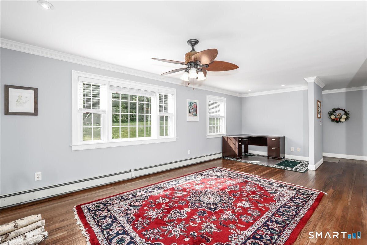 19 Botsford Hill Road Newtown, CT 06470 - Photo 16 of 40 an empty room with wooden floor and a rug