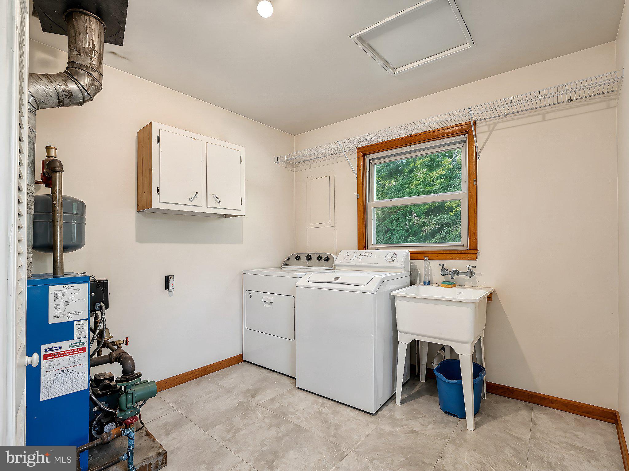13315 Point Lookout Road Ridge, MD 20680 - Photo 22 of 51 Bright and functional laundry space.