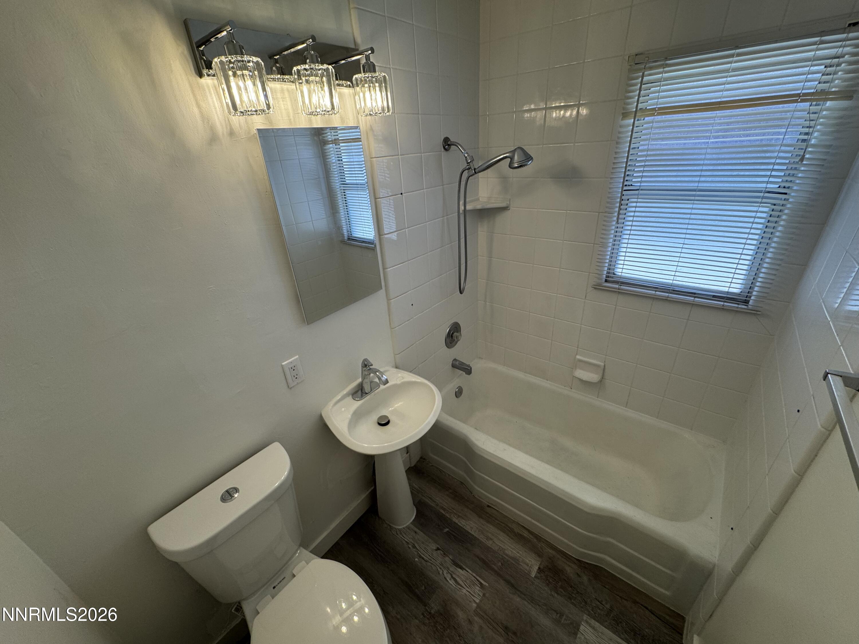 70 Arden Circle Reno, NV 89503 - Photo 10 of 15 a bathroom with a toilet sink and mirror