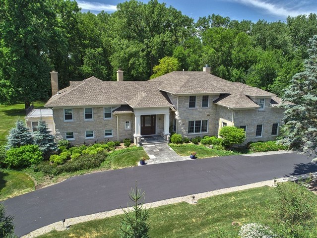30 Meadowview Road Winnetka, IL 60093 - Photo 1 of 34 a front view of a house with a yard and potted plants