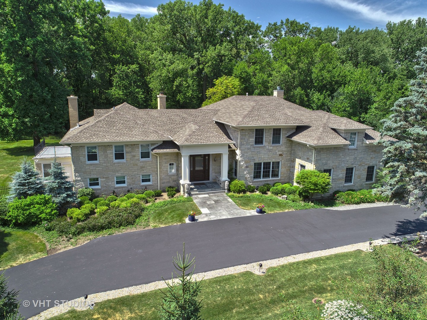 30 Meadowview Road Winnetka, IL 60093 - Photo 2 of 34 a front view of a house with a yard and potted plants