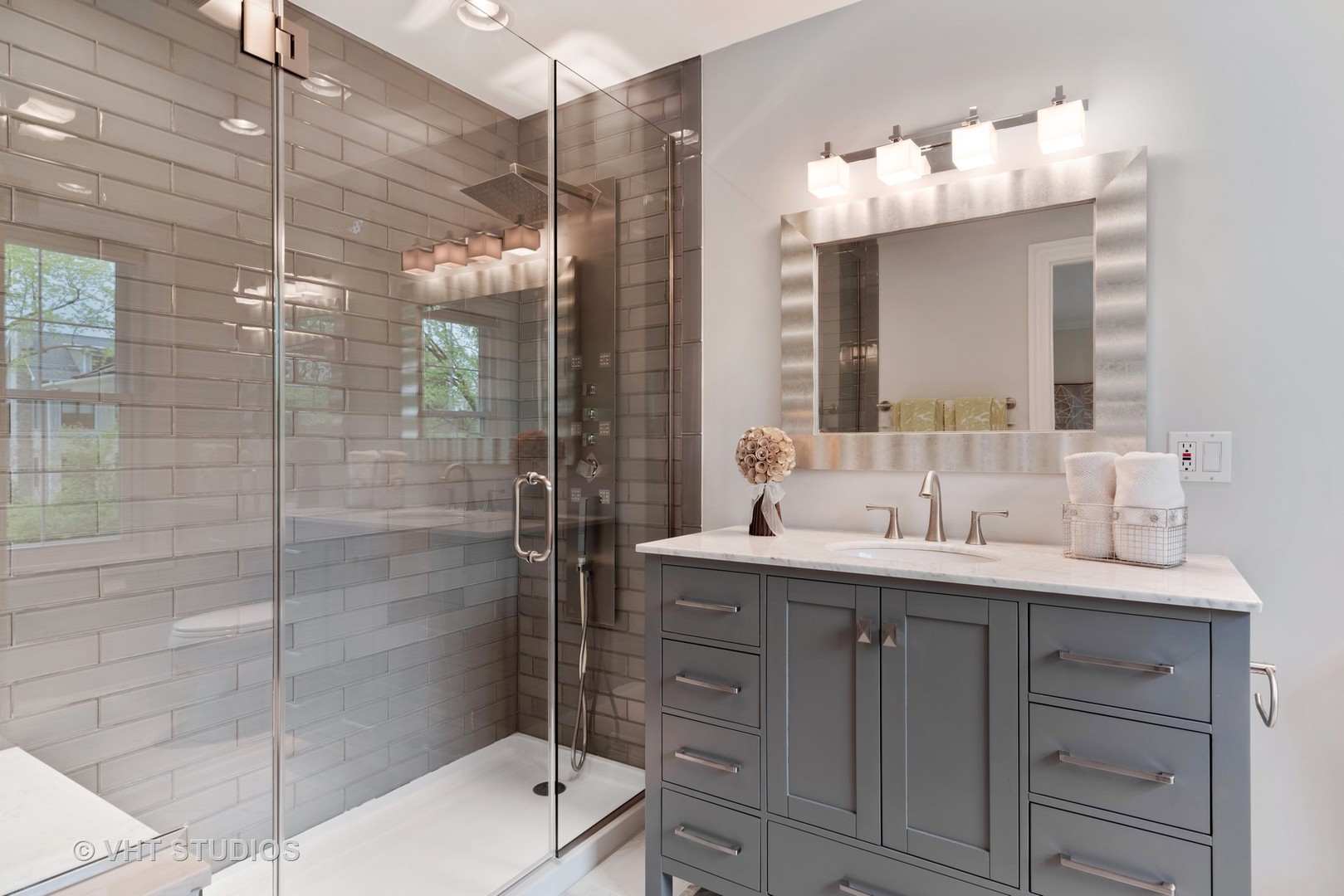 30 Meadowview Road Winnetka, IL 60093 - Photo 27 of 34 a bathroom with a double vanity sink mirror and shower