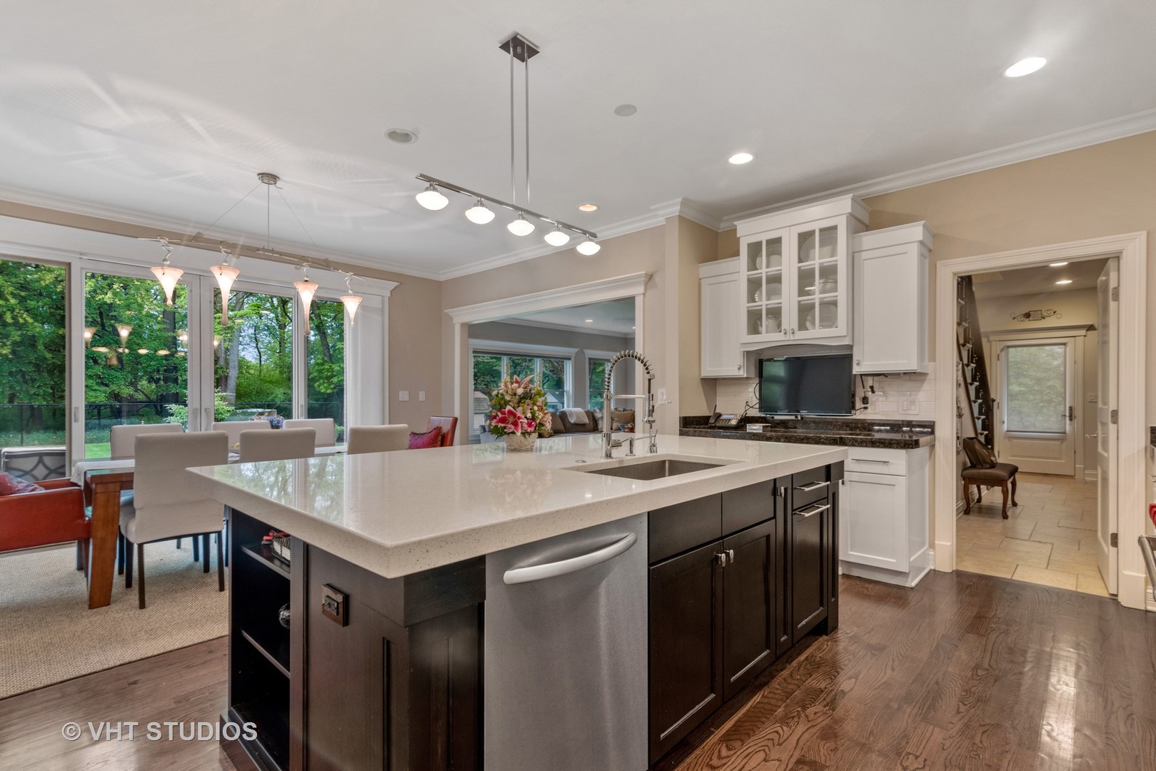 30 Meadowview Road Winnetka, IL 60093 - Photo 8 of 34 a kitchen with kitchen island a sink dining table and chairs