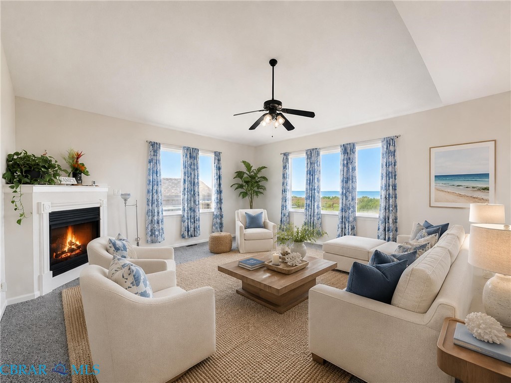 1214 Dandy Loop Road Yorktown, VA 23692 - Photo 26 of 65 a living room with furniture fireplace and a large window