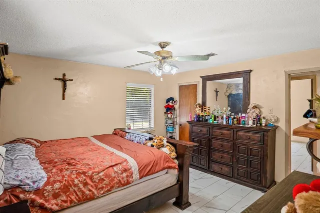 a bed room with a bed and a mirror