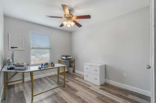 a view of workspace with wooden floor