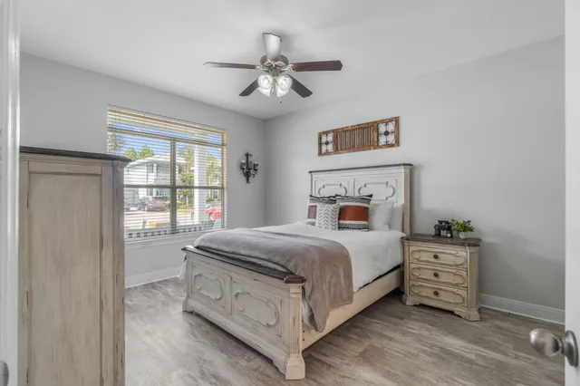 a bedroom with a large bed and a window