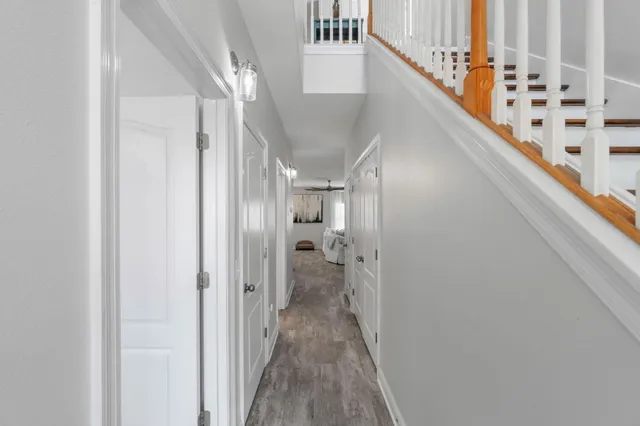 a view of hallway with wooden floor