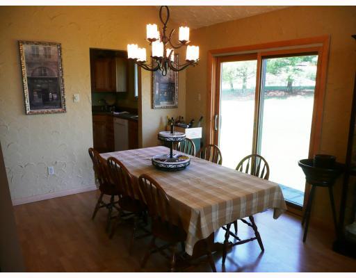 Dining Room. Bright yet Cozy with lots of natural light from the new Pella sliding doors to the outside.  A glass of wine sounds wonderful within these unique styled plaster walls adding a wonderfully relaxedchateau feel!
