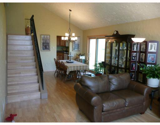 Dining Room. You could have Banquet seating with all of this room!  Open and Inviting with cathedral ceilings and new Pella sliding doors to let in all that natural light.  Never feel cramped again!