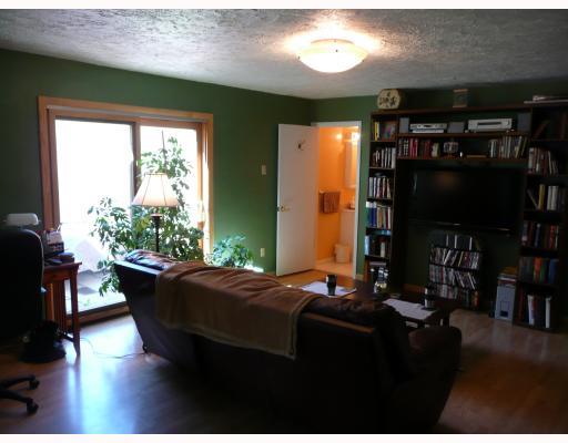 Den/Family/Great Room. Lower Level Family Room is very roomy with lots of natural lighting and full bath.  New Pella Sliding Doors leads out to a stamped concrete looking paved patio.