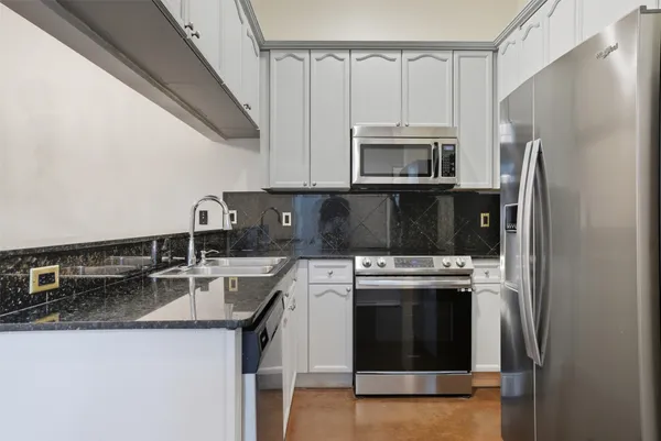 a kitchen with a stove and a microwave