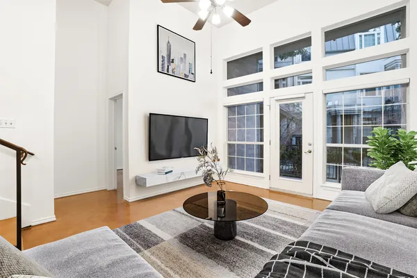 a bedroom with a large bed and a large window