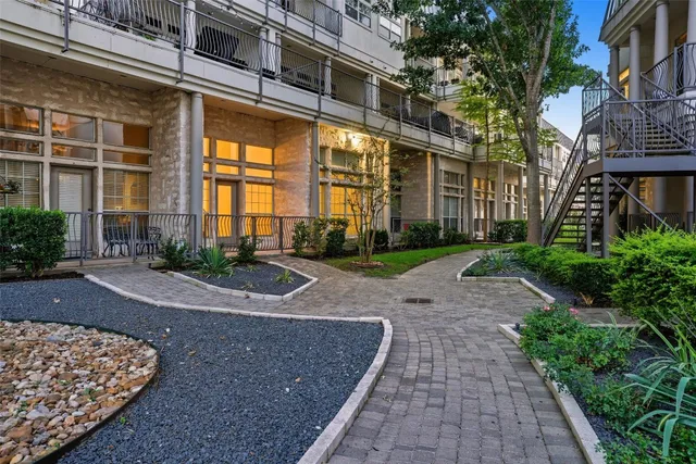 a view of a balcony with a pot
