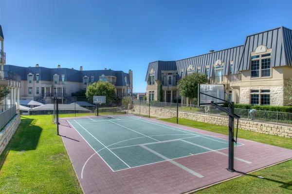 a view of a swimming pool with a yard