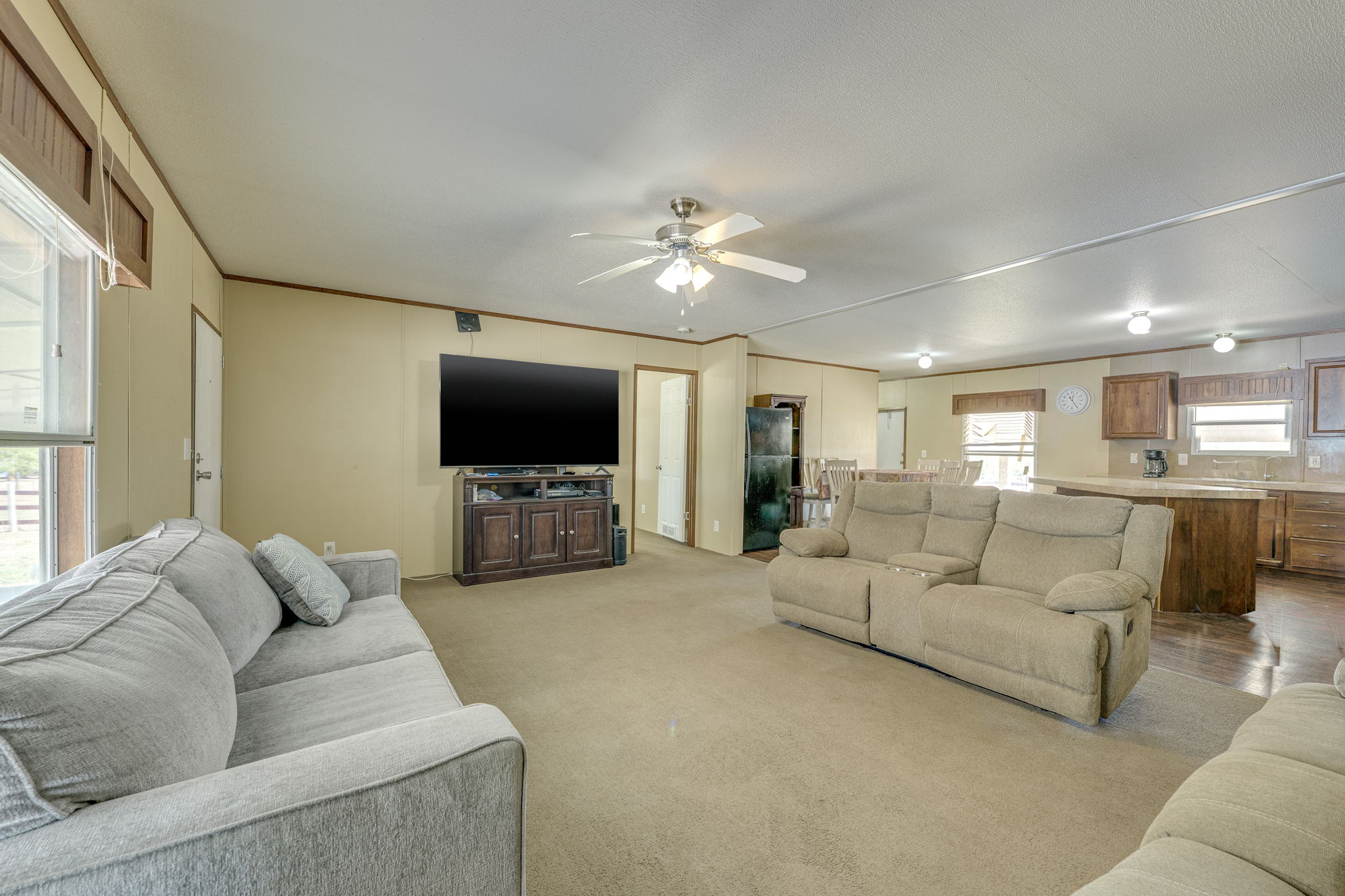 1781 Long Road Lockhart, TX 78644 - Photo 17 of 17 An open floor plan connects the comfortable living area to the adjacent kitchen.