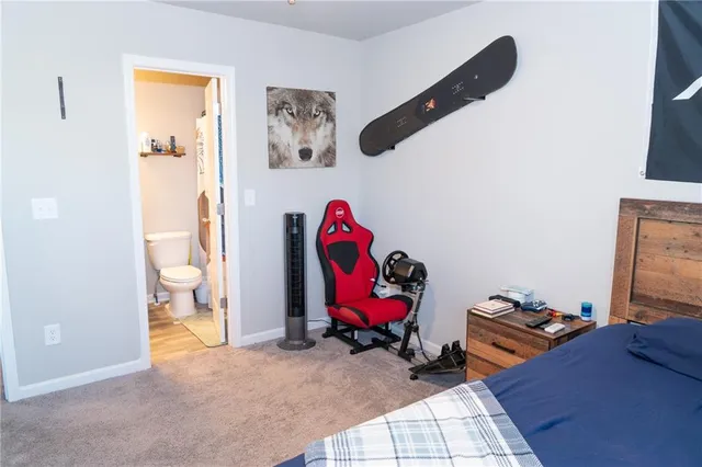 a bedroom with a bed and a couch