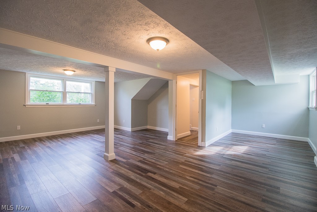 2982 Arcola Road Madison, OH 44057 - Photo 22 of 38 Huge Lower Level Family Room with beautiful luxury vinyl flooring