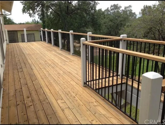a balcony with wooden floor