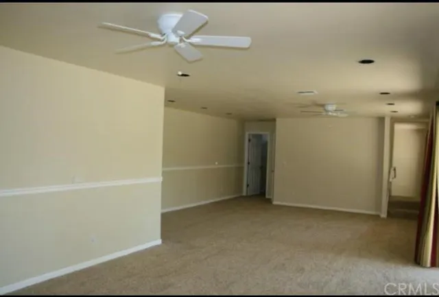 a bathroom with a granite countertop shower and a sink