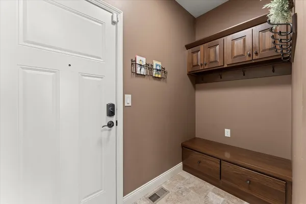 a spacious bedroom with a bed and a ceiling fan