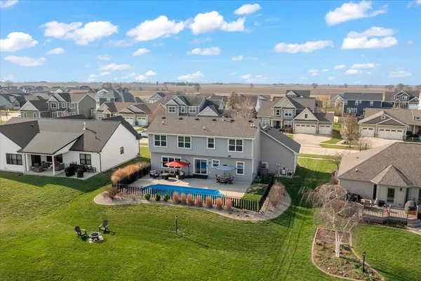 an aerial view of multiple houses with yard