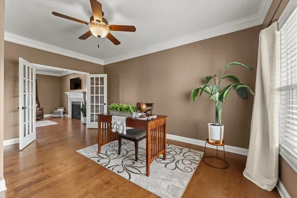 a view of a dining room with furniture and wooden floor