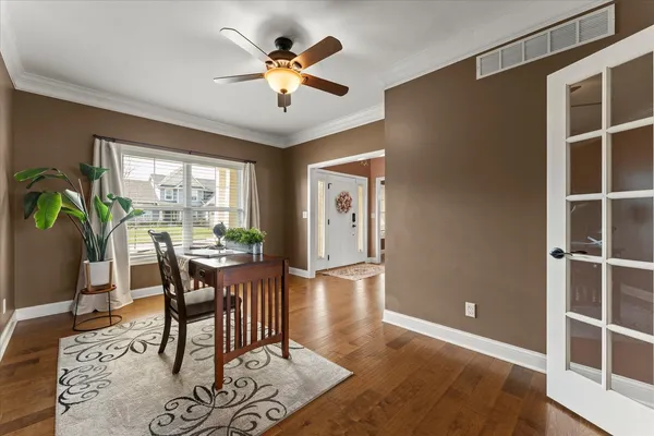 a view of a dining room with furniture window and wooden floor