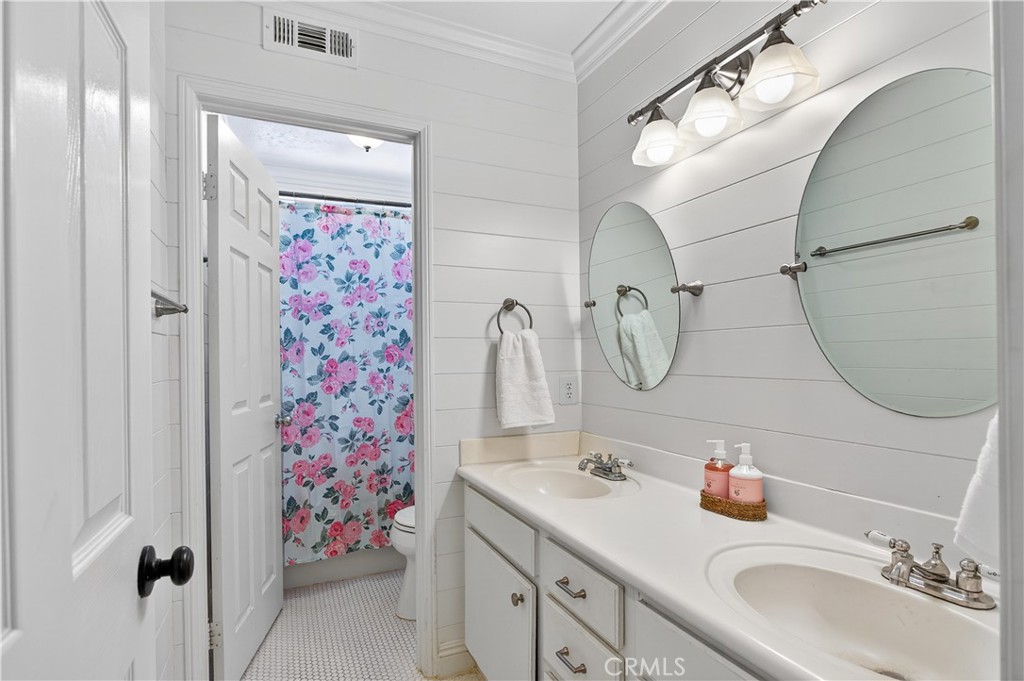 31928 Cercle Chambertin Temecula, CA 92591 - Photo 44 of 74 a bathroom with a sink vanity and shower