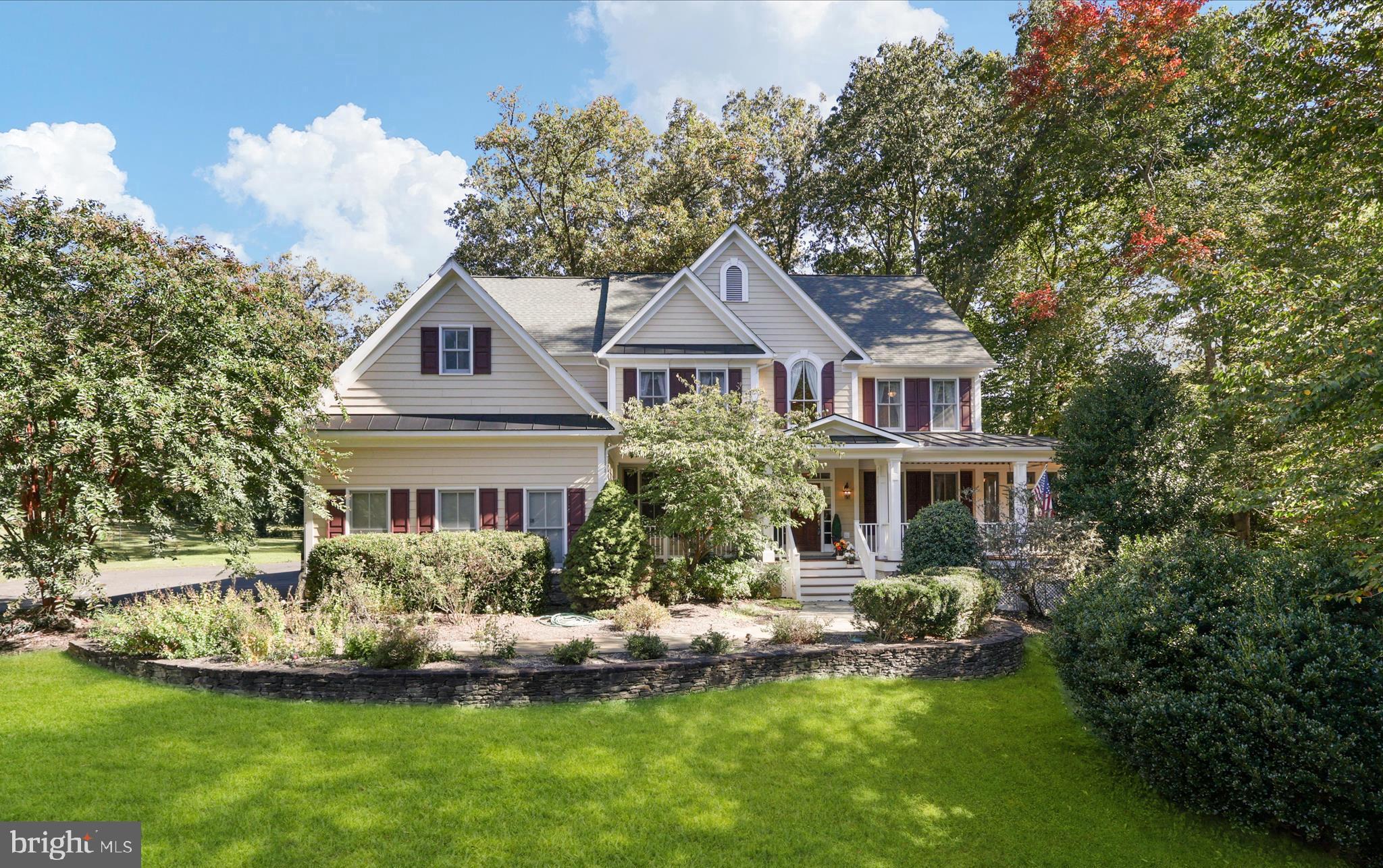 a front view of a house with a yard table and chairs