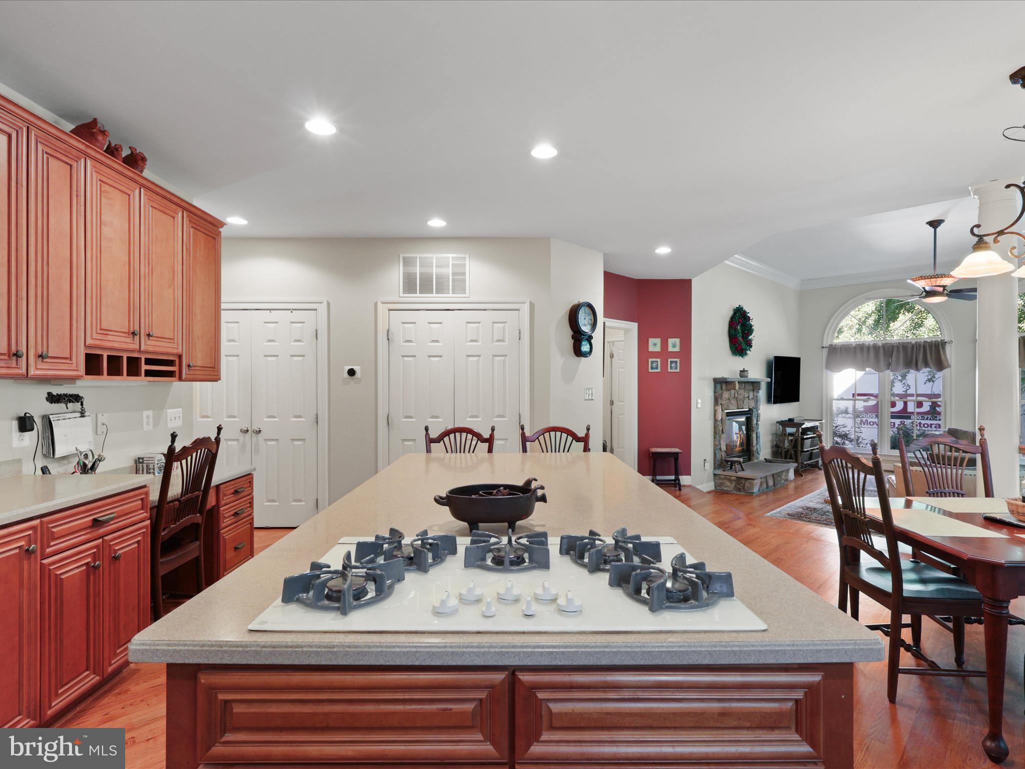 12848 Redbird Ridge Clifton, VA 20124 - Photo 14 of 76 a kitchen with stainless steel appliances kitchen island granite countertop a sink and cabinets