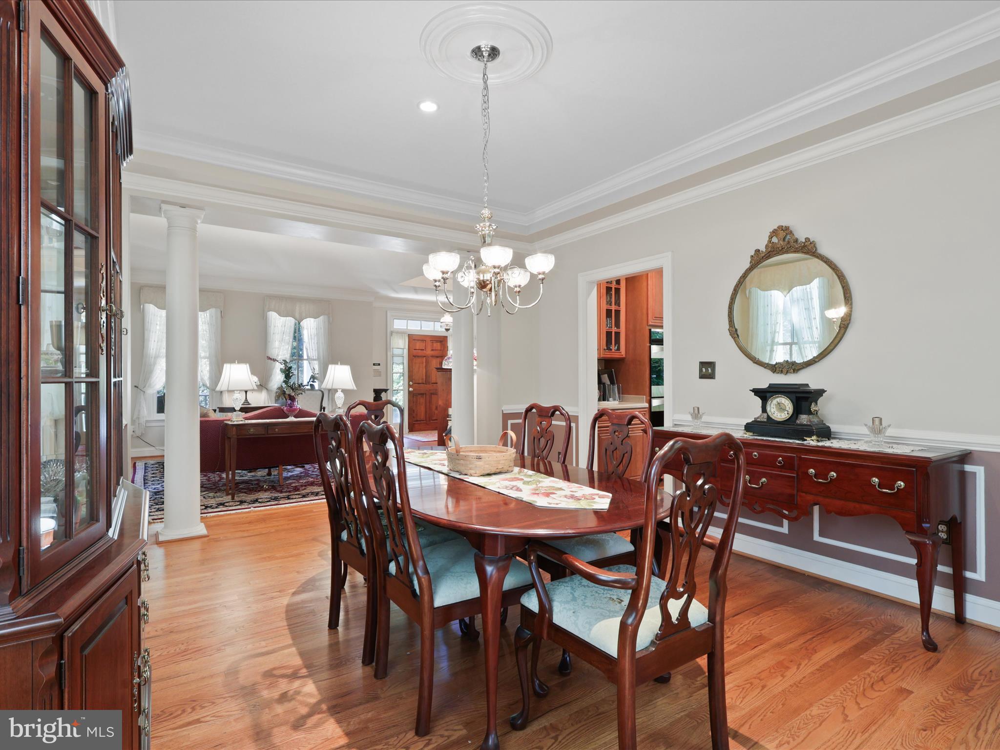 12848 Redbird Ridge Clifton, VA 20124 - Photo 25 of 76 a view of a dining room with furniture and chandelier