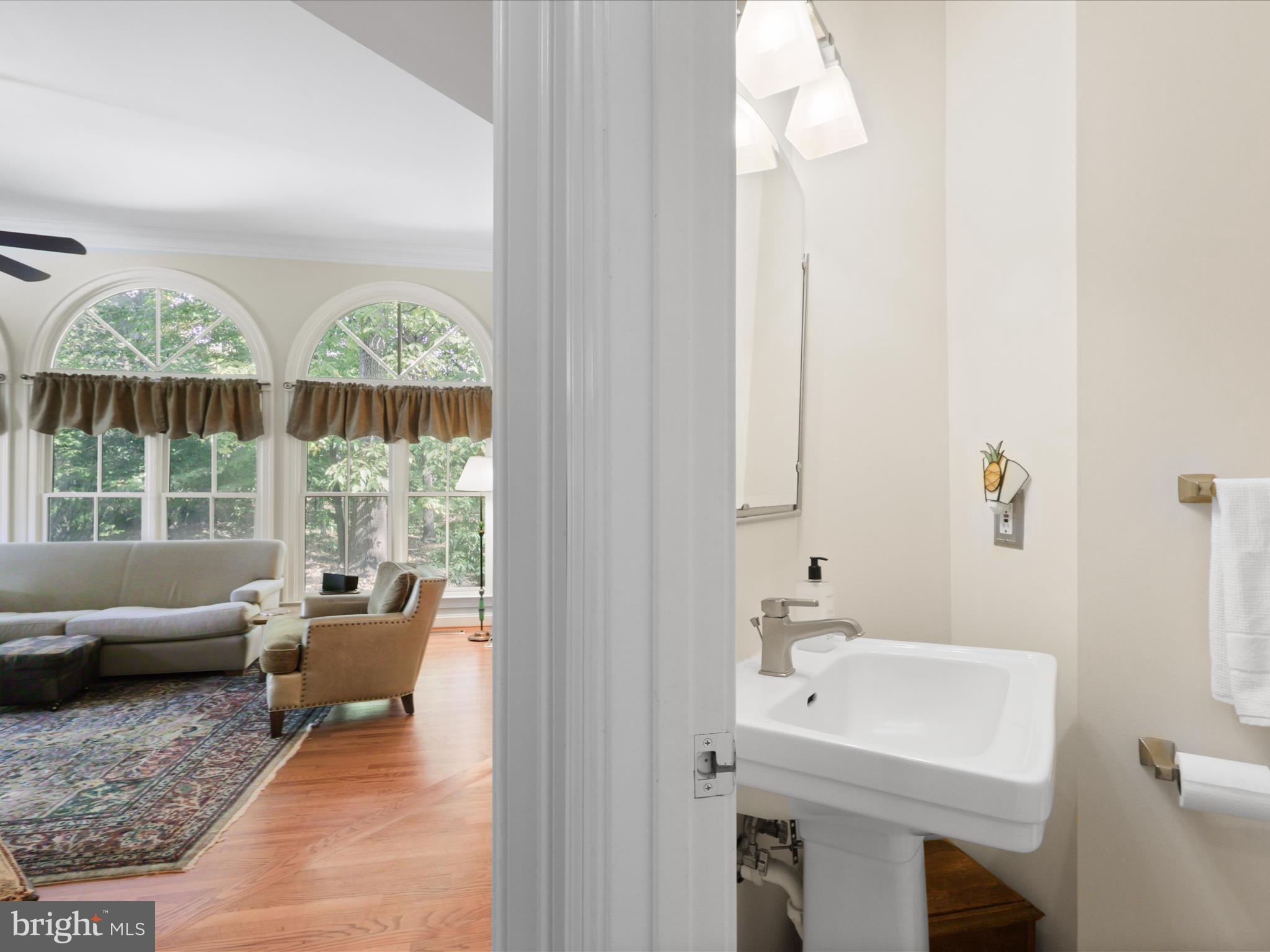 12848 Redbird Ridge Clifton, VA 20124 - Photo 26 of 76 a living room with furniture and a large window