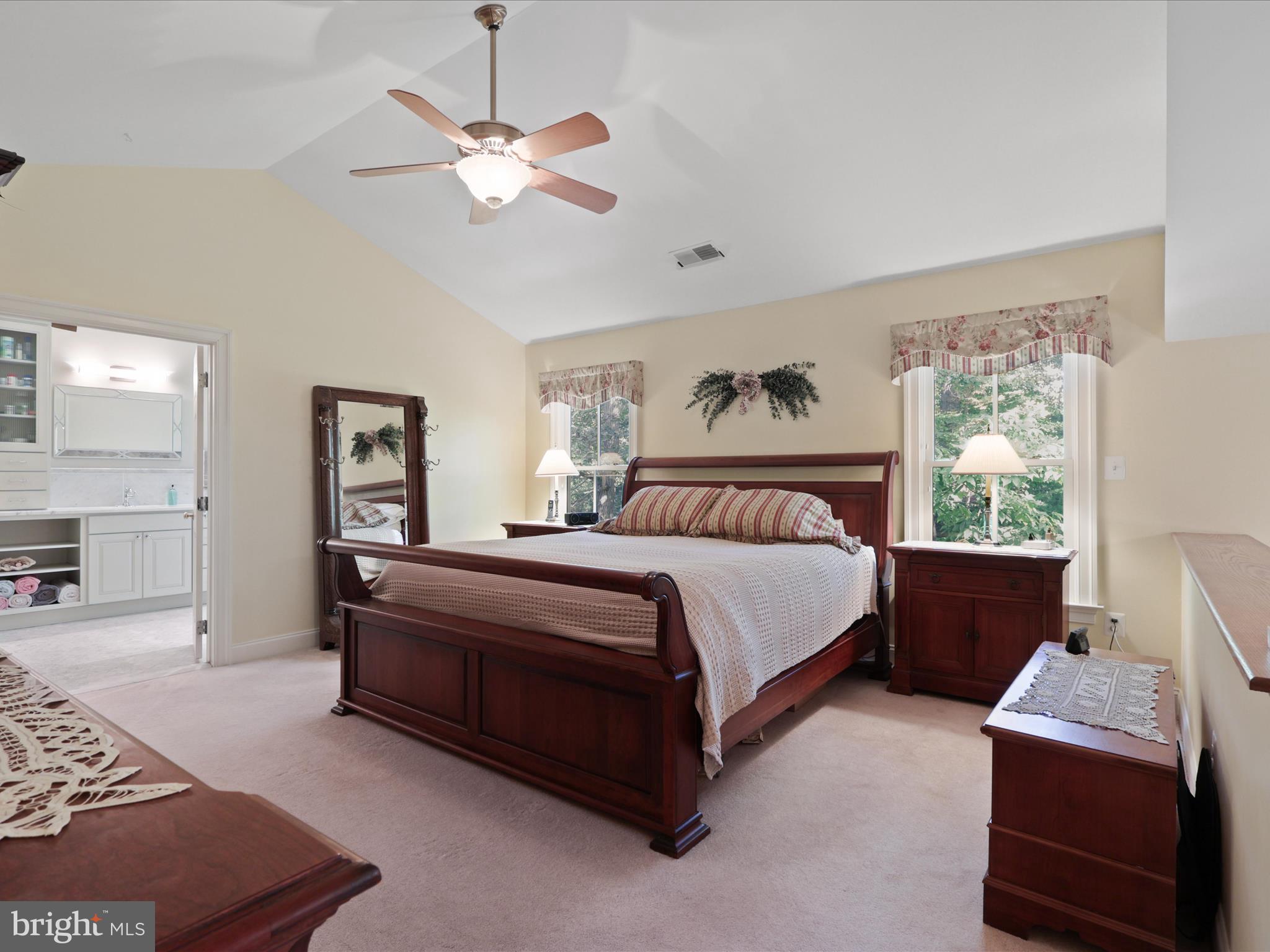 12848 Redbird Ridge Clifton, VA 20124 - Photo 28 of 76 a bedroom with a bed a couch and a window