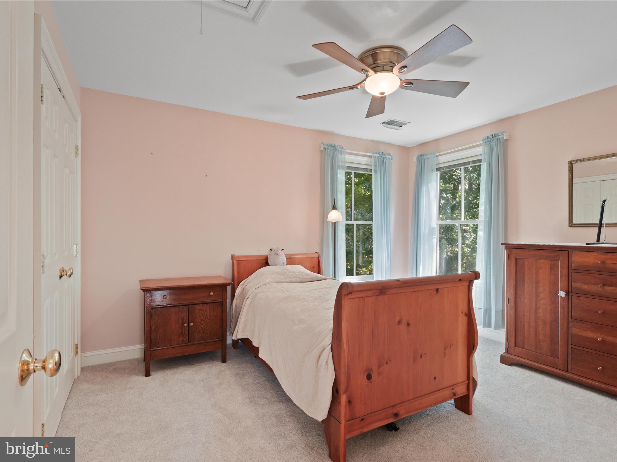 12848 Redbird Ridge Clifton, VA 20124 - Photo 37 of 76 a bed room with a bed and a ceiling fan